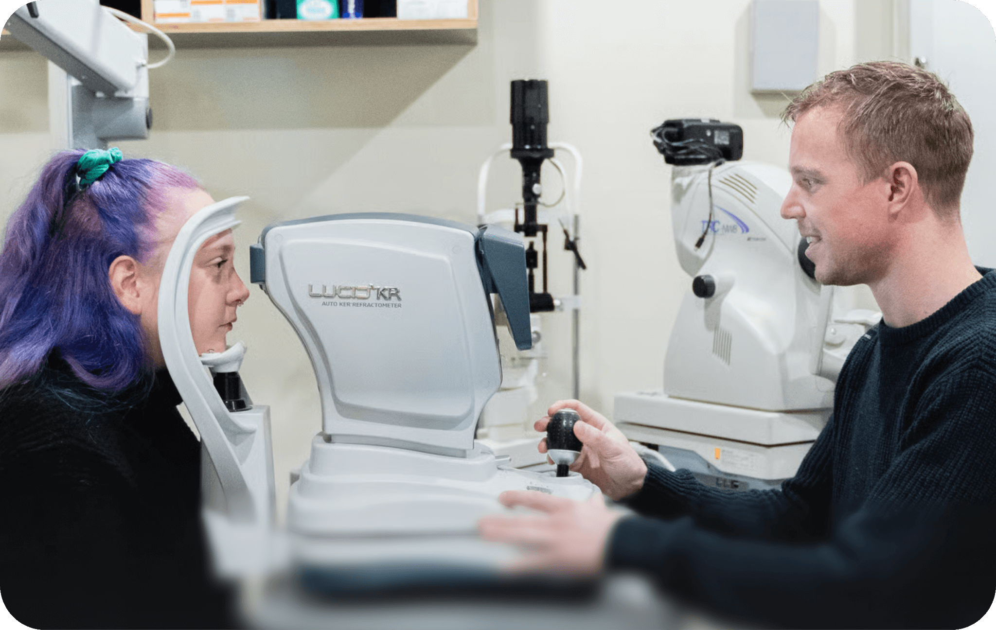 A qualified optometrist at Dresden Vision Australia performing a precise autorefraction scan on a patient to measure their refractive error and aid in determining the new prescription.