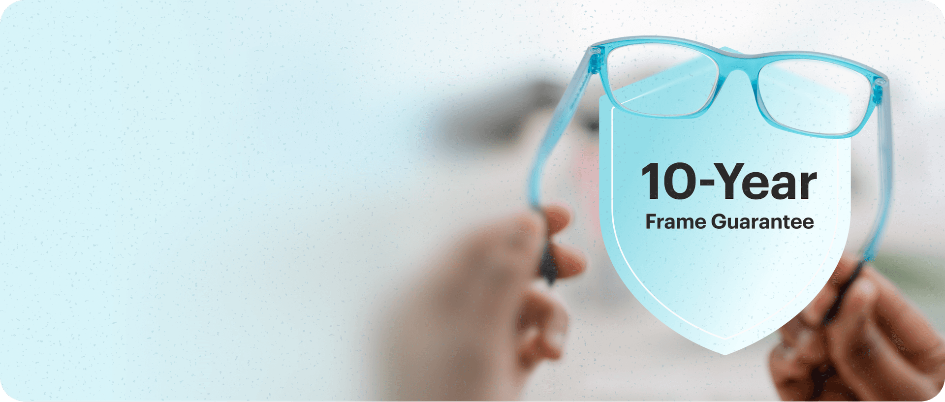 A pair of flexible, light-blue modular frames being held, representing the product confidence and long-term 10-year guarantee provided to customers by Dresden Vision New Zealand.