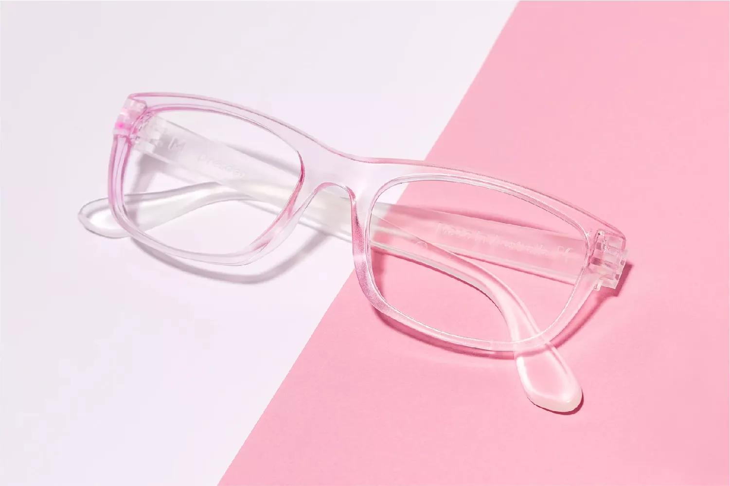 A Dresden eyeglass with a shade of pink in the background,