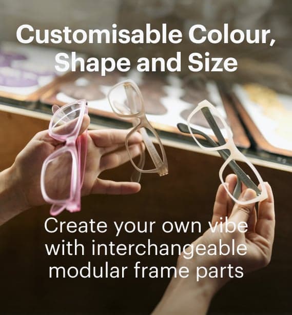 Dresden Vision hands holding glasses frames showing interchangeable parts and customisable eyewear design